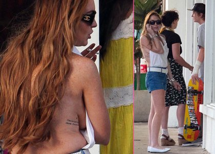Ops! Lindsay Lohan naokoli brez modrca in z napol odprto majico
