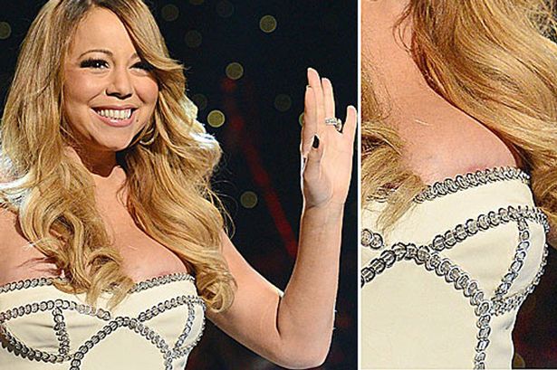 Ops! Bujni Mariah Carey iz (pre)majhne obleke pobegnila bradavička
