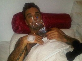 Robbie Williams zaradi zastrupitve odpovedal koncert